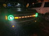 Ford Bronco outside in the rain with Oculus™ ColorSHIFT® Bi-LED Projector Headlights installed and turned on with green halos