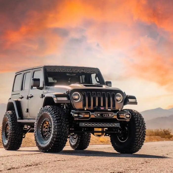 Three quarters view of a Jeep with Oculus Headlights and LED Integrated Skid Plate installed.