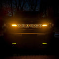 Front view of a Ford Bronco with Amber LED Illuminated Letter Badges.