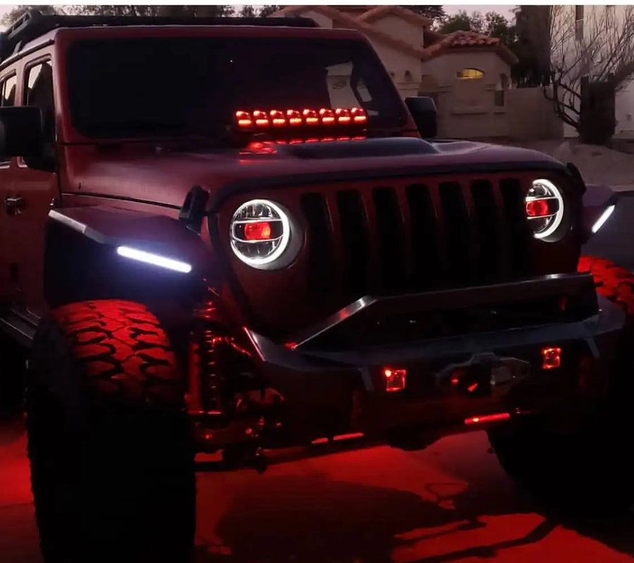 Red Jeep Wrangler JL with matching red demon eye projectors.