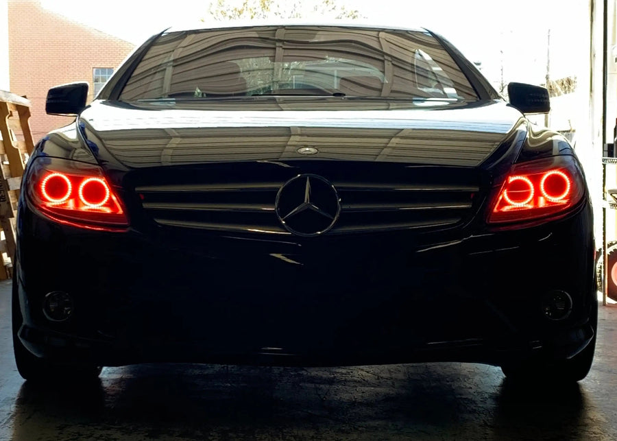 Front end of a Mercedes Benz CL 550 with red LED headlight halo rings.