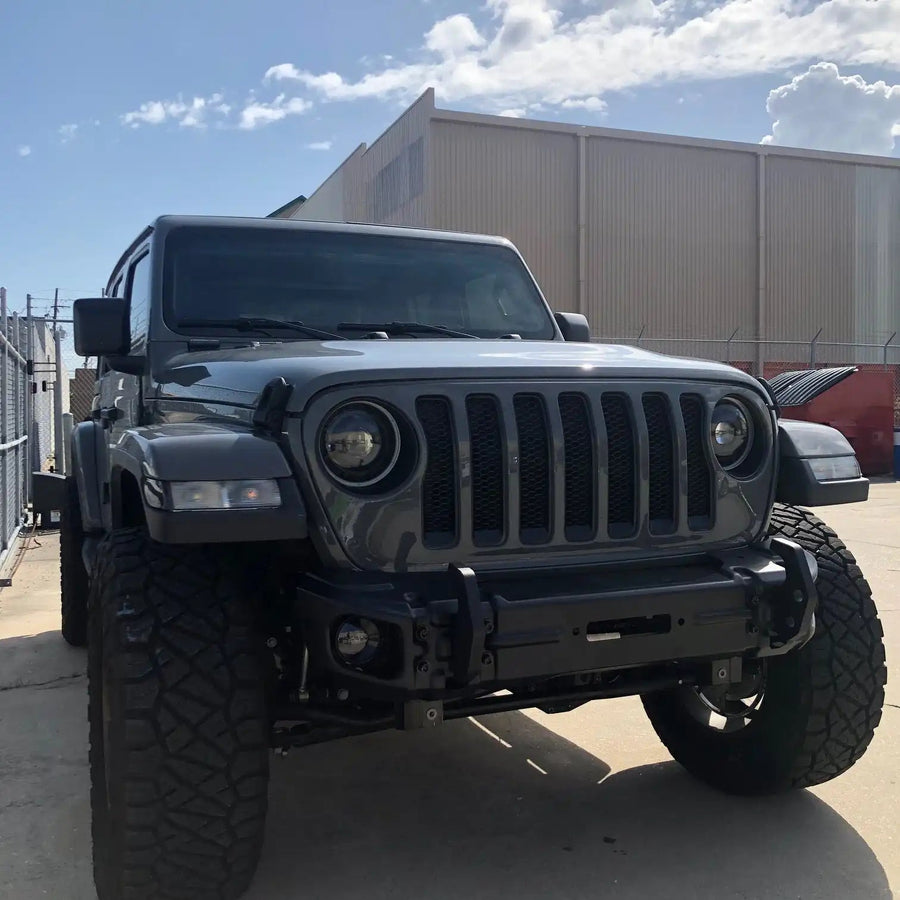 Front end of a Jeep with High Performance 20W LED Fog Lights installed.