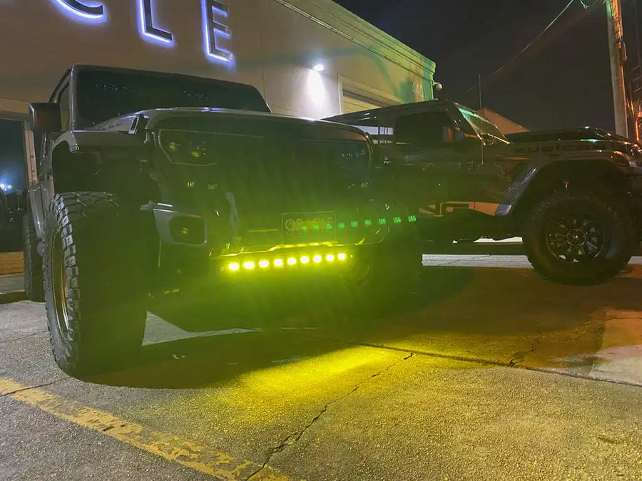 Multiple fog beam emitter modules installed on jeep bumper