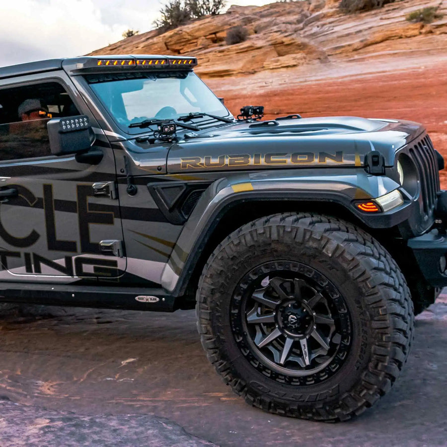 Side view of a Jeep Gladiator JT equipped with multiple LED lighting products, including the Sidetrack LED Lighting System.
