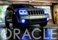 Front end of a Jeep Grand Cherokee with white LED headlight and fog light halos.