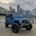 Three quarters view of a Jeep Wrangler with 7" High Powered LED Headlights installed.