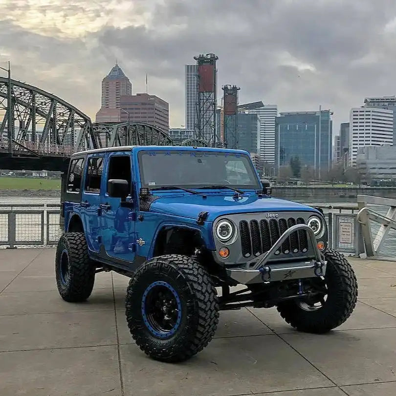 Three quarters view of a Jeep Wrangler with 7" High Powered LED Headlights installed.