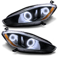 Maserati GranTurismo headlights with white halo rings.