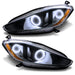 Maserati GranTurismo headlights with white halo rings.