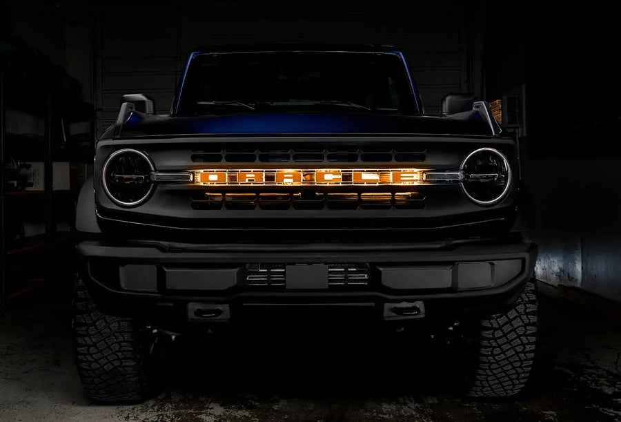 Front view of a Ford Bronco with Amber LED Illuminated Letter Badges installed.