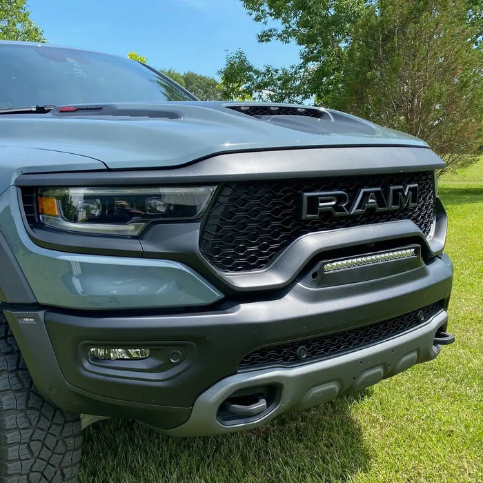 Front end of a RAM TRX with Front Bumper Flush LED Light Bar System installed with white LEDs