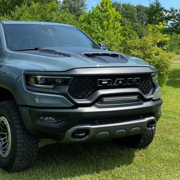 Front end of a RAM TRX with Front Bumper Flush LED Light Bar System installed with white LEDs