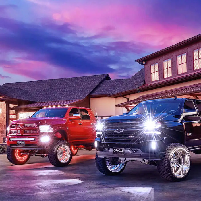 Two trucks side by side, both with ORACLE Lighting License Plates in front.