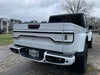 White Jeep Gladiator JT with a white Racetrack Flush Style LED Tailgate Panel Light installed.