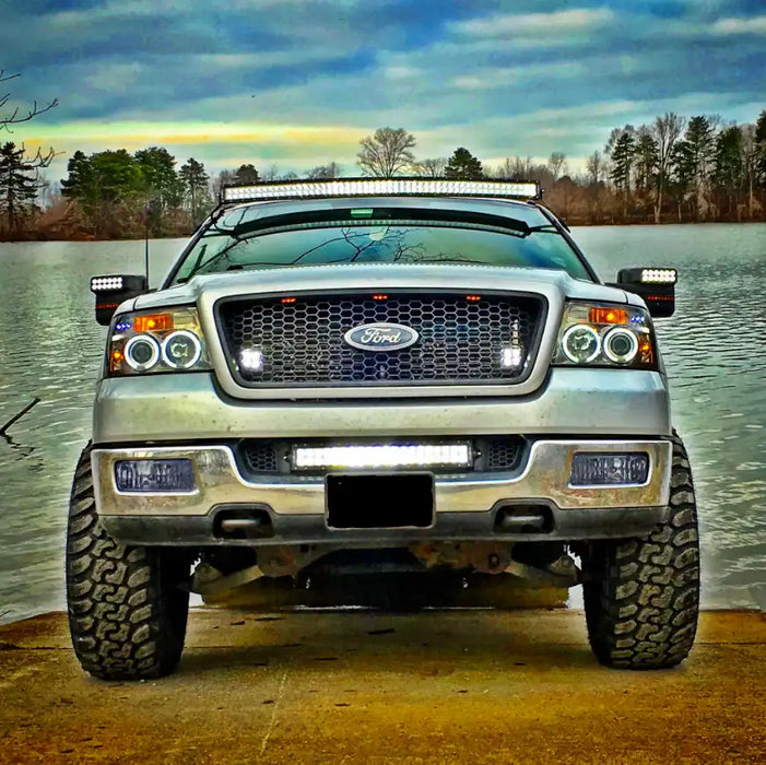 Front end of a Ford F-150 with multiple ORACLE Lighting products installed, including LED Off-Road Side Mirrors.