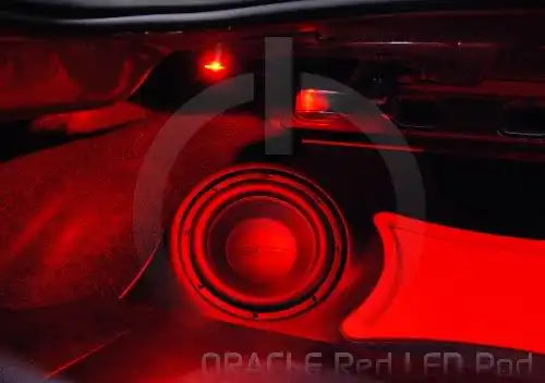 Speaker system with red LED pod behind