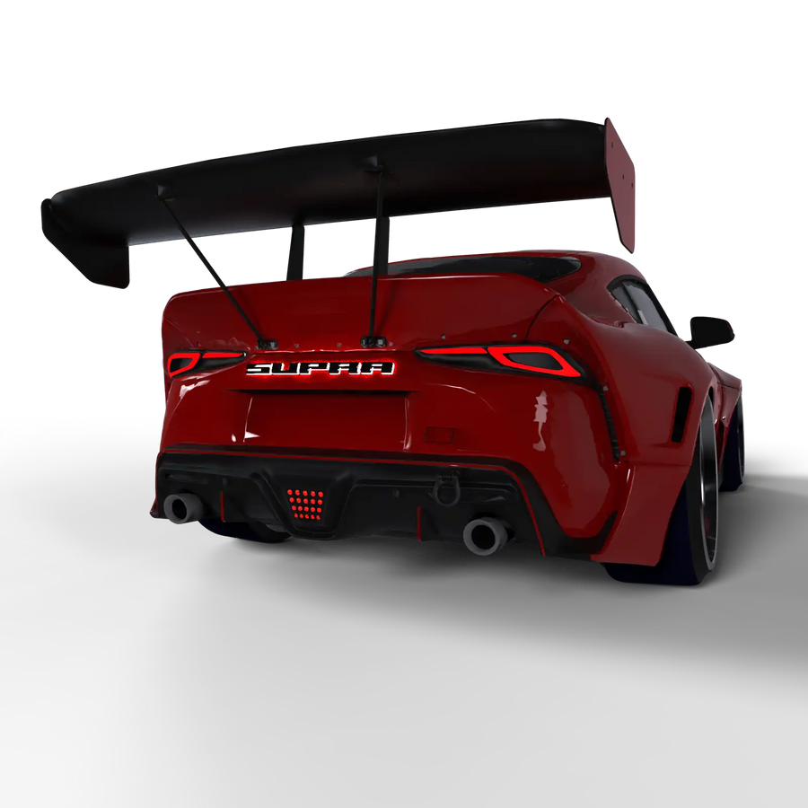 Rear end of a Red Toyota Supra with Illuminated LED Letter Badges installed. The letters read: "Supra"