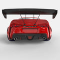 Rear view of a red Toyota Supra with Universal Illuminated LED Letter Badges installed above the license plate area.