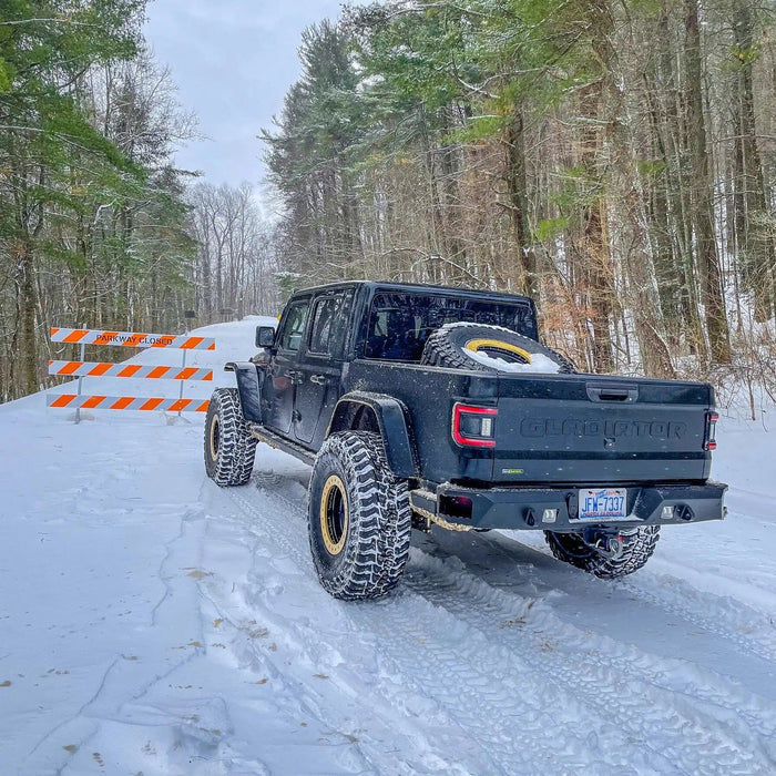 Rear view of a Jeep Gladiator in the snow, equipped with Flush Mount LED Tail Lights.