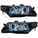 Acura TSX headlights with white LED halo rings.