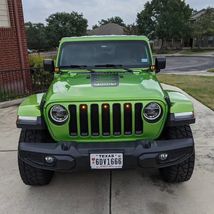 Front end of a Jeep Wrangler with amber LED Grill Light Kit installed.