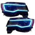 Jeep Grand Cherokee headlights with cyan DRLs.