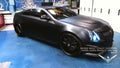 Three quarters view of a Cadillac CTS-V Coupe with white LED headlight halo rings installed.