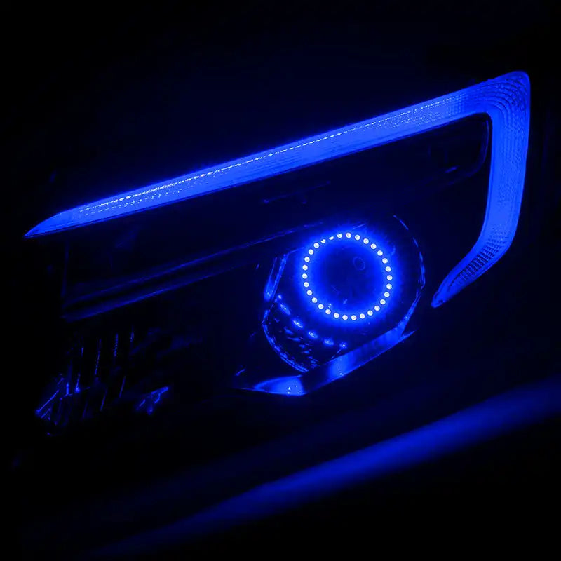 Honda Ridgeline headlight with blue halo and DRL.