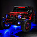 Three quarters view of a red Jeep Wrangler JL, with ColorSHIFT Oculus Headlights, and blue halo rings.