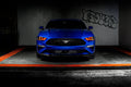 Front view of a Ford Mustang with red headlight halos and DRLs.