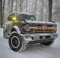 Ford Bronco in snowy weather with glowing orange amber LED letter badges