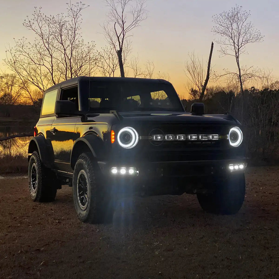 Ford Bronco outside with headlights and fog lights on