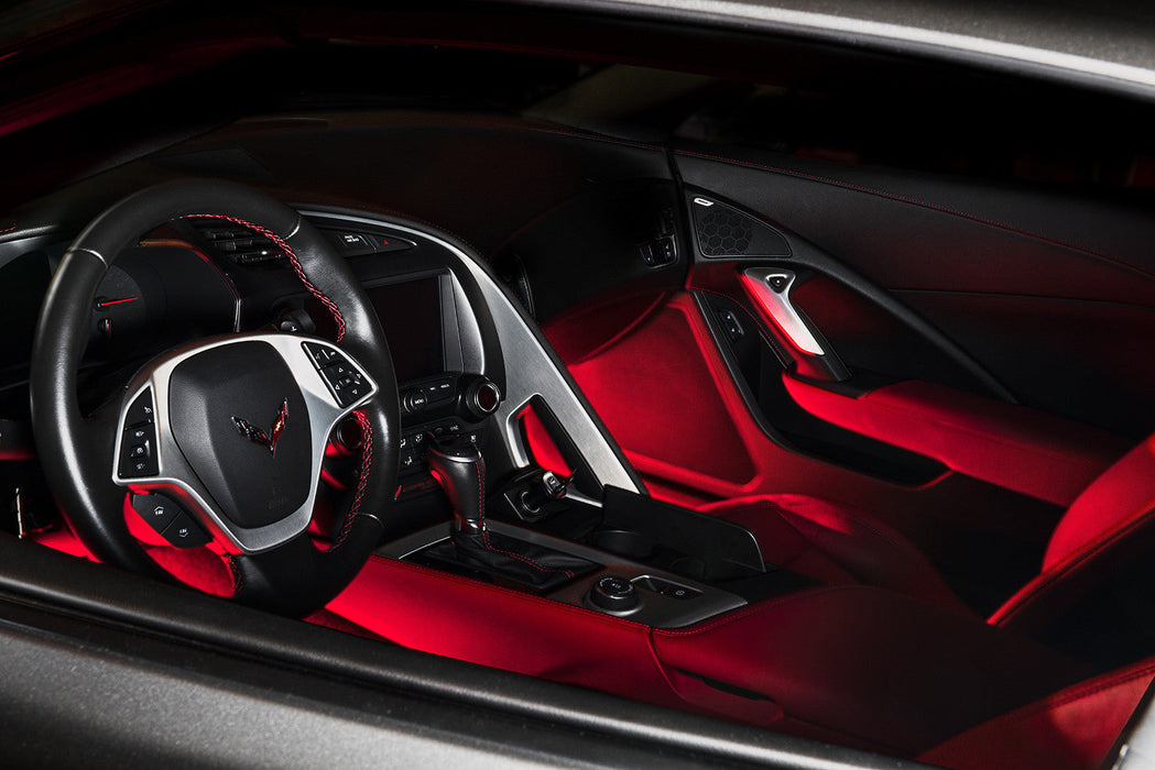 Car interior with red LED footwell lighting