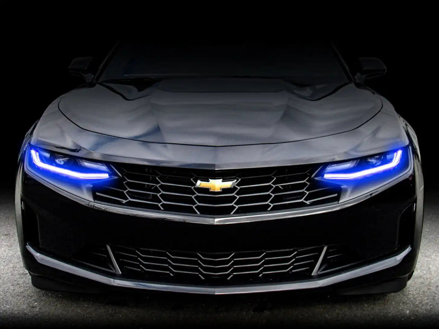 Front end of a Chevrolet Camaro with blue headlight DRLs.