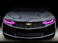 Front end of a Chevrolet Camaro with pink headlight DRLs.