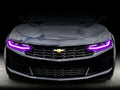 Front end of a Chevrolet Camaro with pink headlight DRLs.