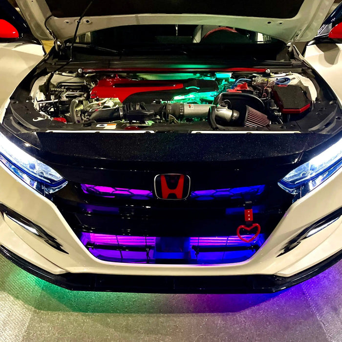 Front view of honda with hood open and LED underglow.