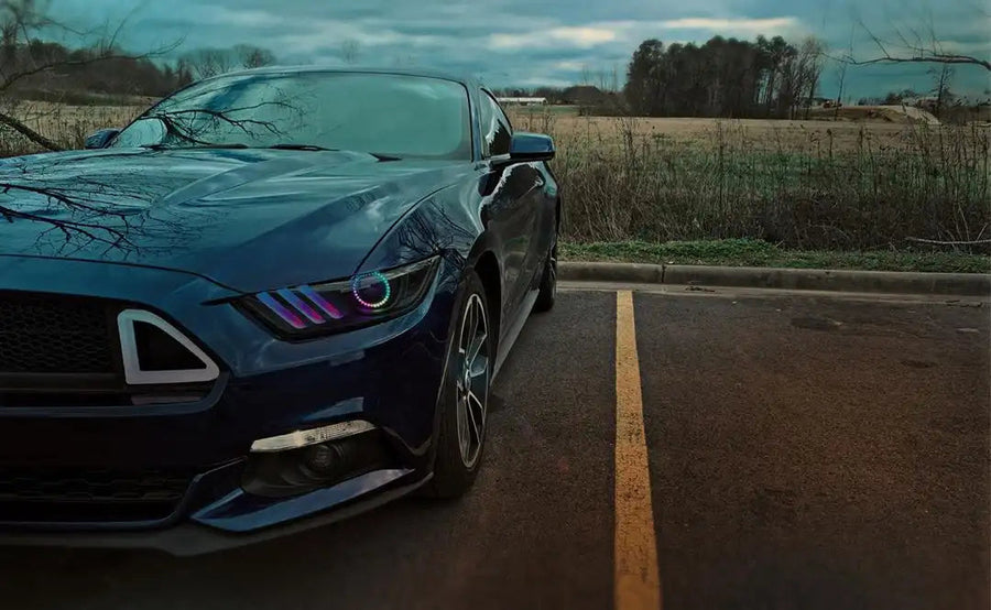 Close-up on a Ford Mustang Headlight unit with Dynamic ColorSHIFT Halos and DRLs installed.