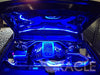 The engine bay of a car with blue LED lighting strips.
