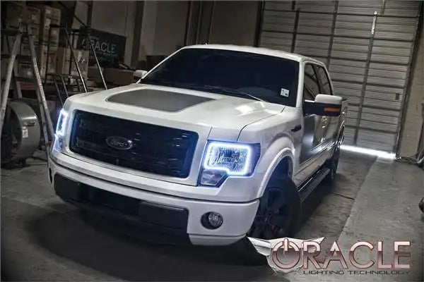 Front end of a Ford F-150 with white LED headlight halo rings.