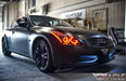Three quarters view of an Infiniti G37 with red LED headlight halo rings installed.