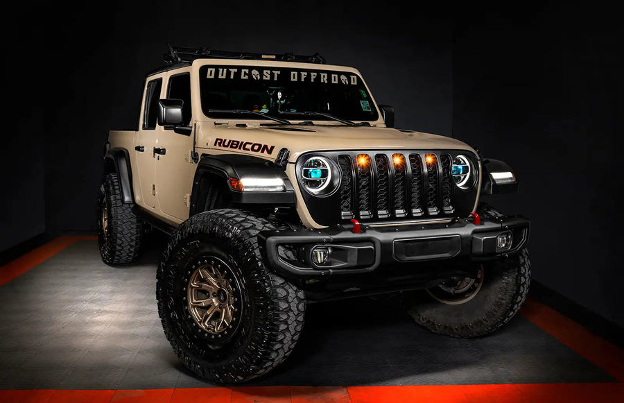 Three quarters view of a Jeep Gladiator JT with cyan demon eye projectors.