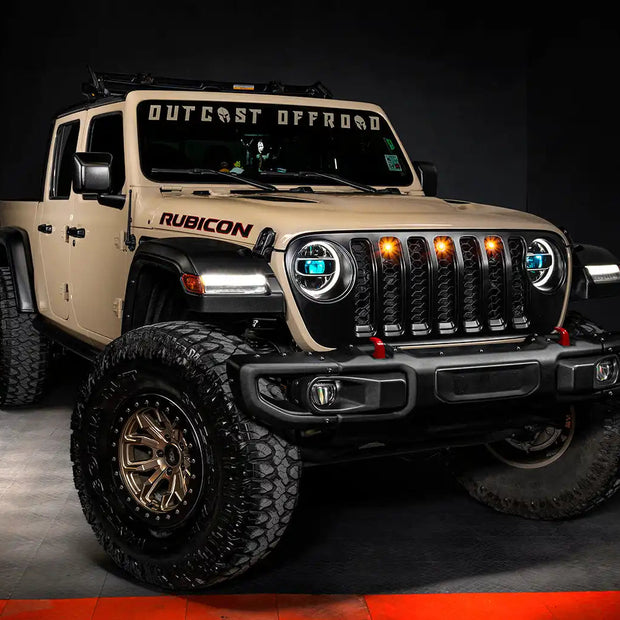 Three quarters view of a Jeep Gladiator JT with cyan demon eye projectors.
