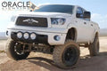 Three quarters view of a Toyota Tundra with white LED headlight halo rings installed.