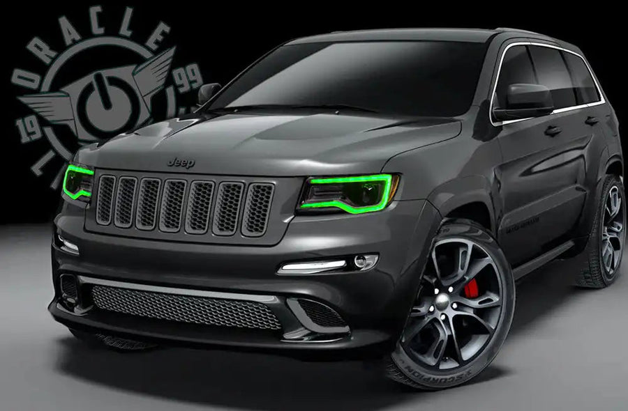 Three quarters view of a Jeep Cherokee with green headlight DRLs.