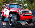 Three quarter view of a Jeep Wrangler JK with Windshield Brackets and Light Combo installed on the roof.