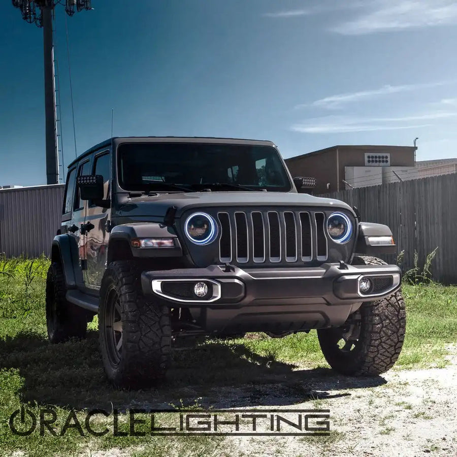 Three quarters view of a Jeep Wrangler with 7" High Powered LED Headlights installed, and white halos on.