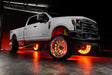 White Ford Superduty with amber LED wheel rings.