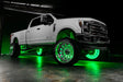 White Ford Superduty with green LED wheel rings.