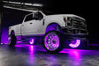 White Ford Superduty with pink LED wheel rings.